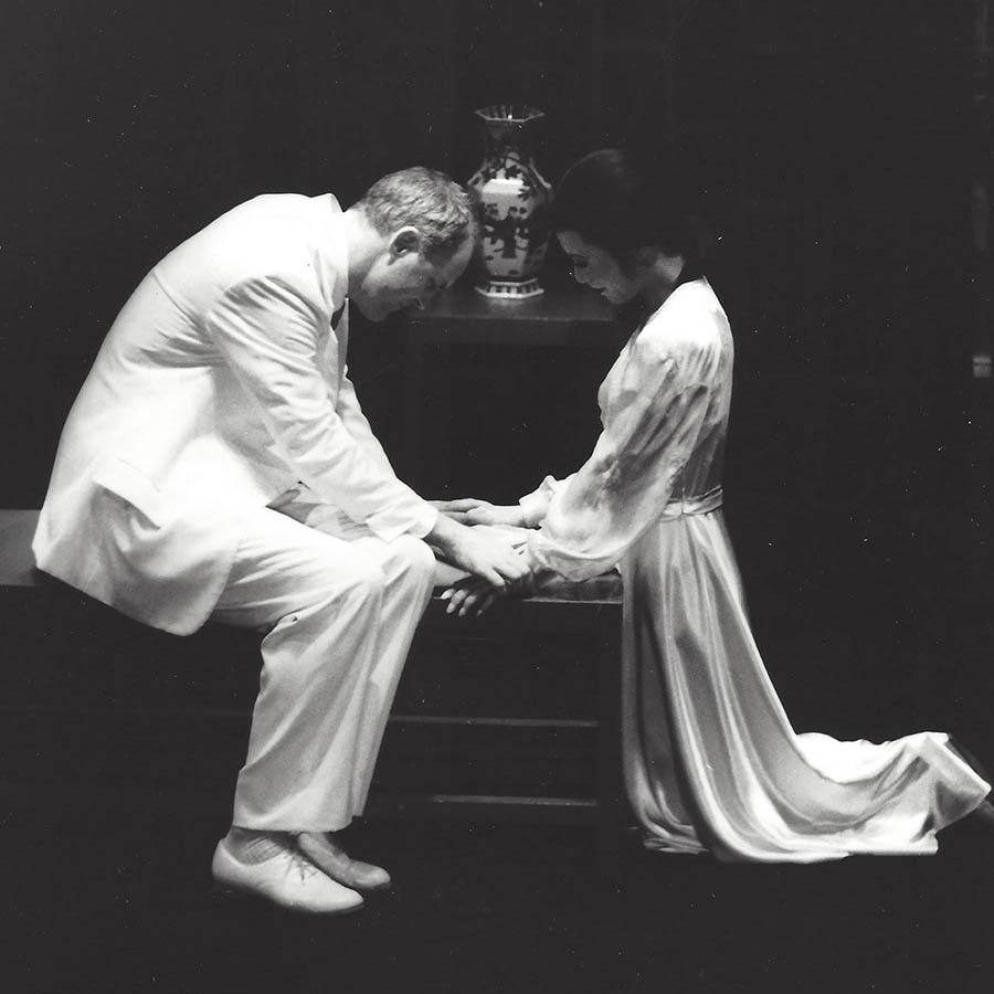 John Lithgow and B.D. Wong hold hands in M. Butterfly.
