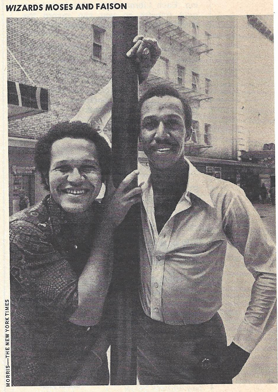 Gilbert Moses and George Faison pose for a newspaper photograph.